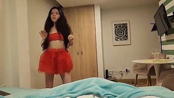 A Stunning Woman In A Red Skirt Desires To Receive A Sexual Gift On Christmas
